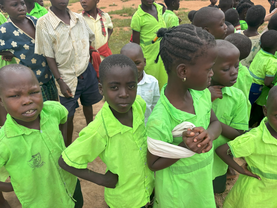Children at their beds in the dormitory