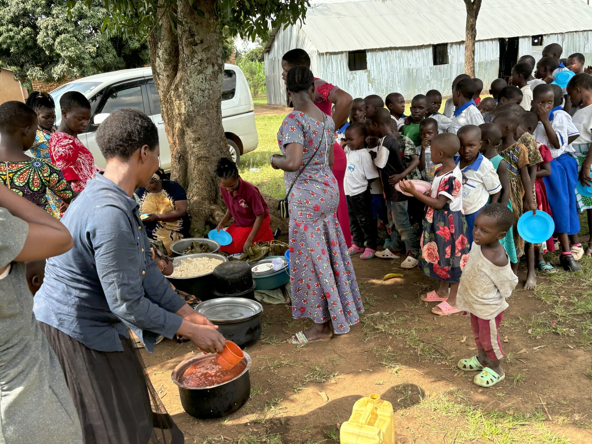 Children receiving a meal through the ministry's compassion